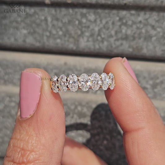 oval cut lab grown diamond wedding band crafted in 14k yellow gold with seven stone layout
