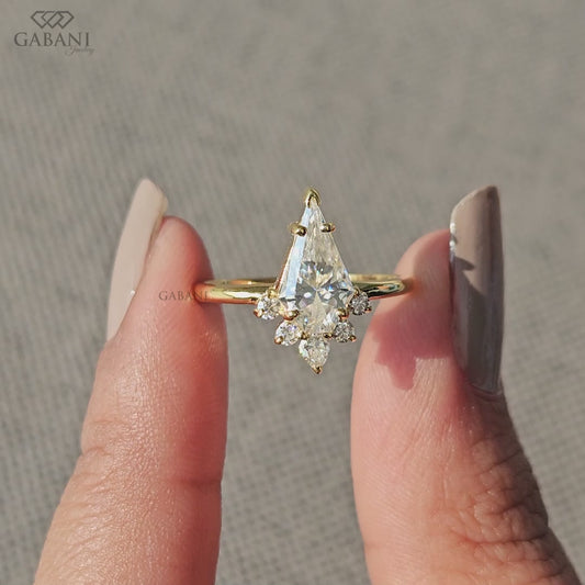 kite cut lab grown diamond ring with vintage design and round pear side stones in yellow gold