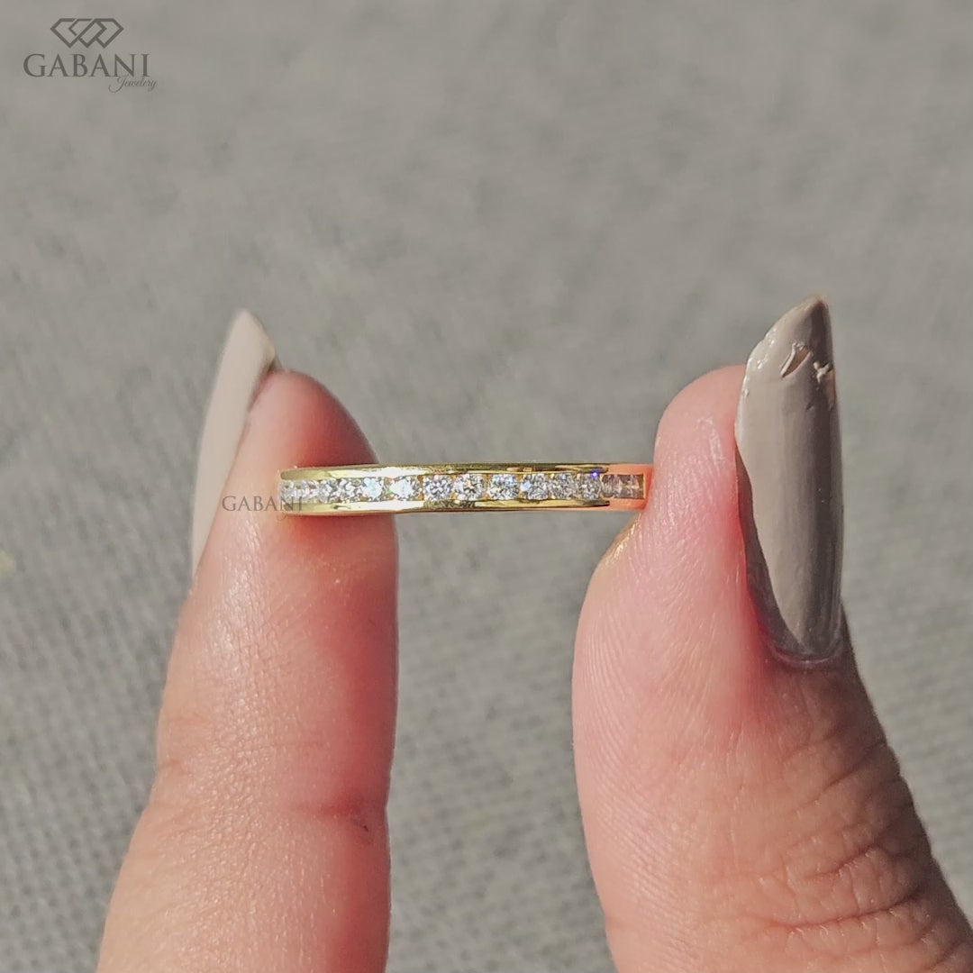 minimal yellow gold half eternity band featuring tiny channel set lab grown diamonds