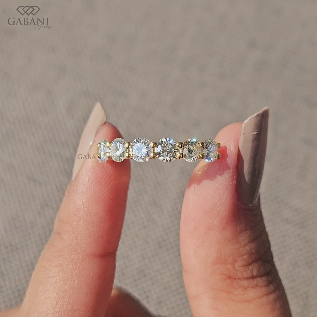 round cut lab grown diamond band featuring seven stones in a sleek U prong setting in yellow gold