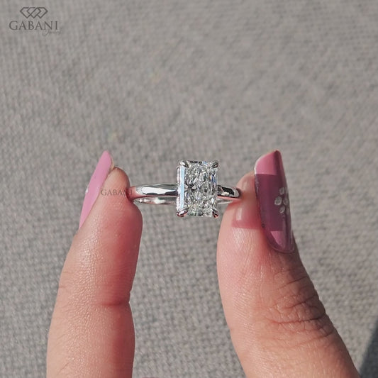 elongated radiant cut lab grown diamond ring set in solid 14k white gold solitaire design