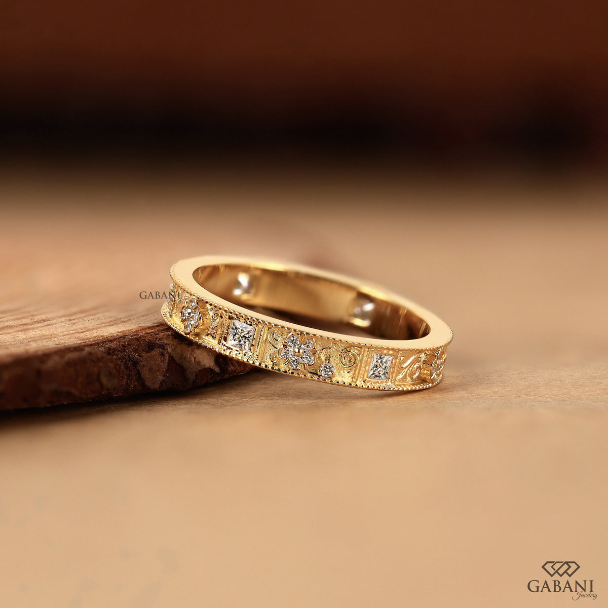 vintage floral diamond wedding band with milgrain edges and lab grown stones in 14k yellow gold