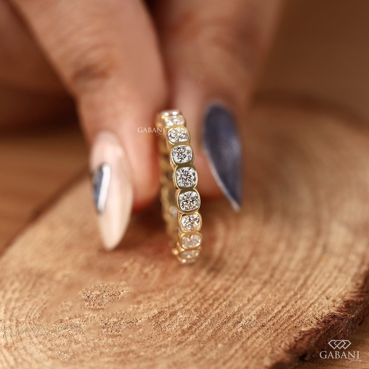 Lab grown diamond band showcasing cushion cut stones in a clean bezel set eternity style