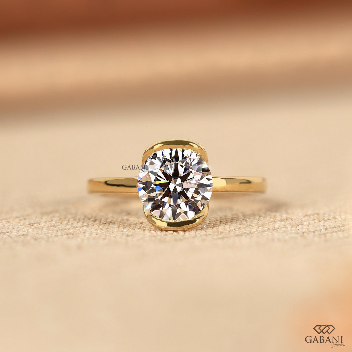 half bezel set round lab grown diamond solitaire ring in yellow gold
