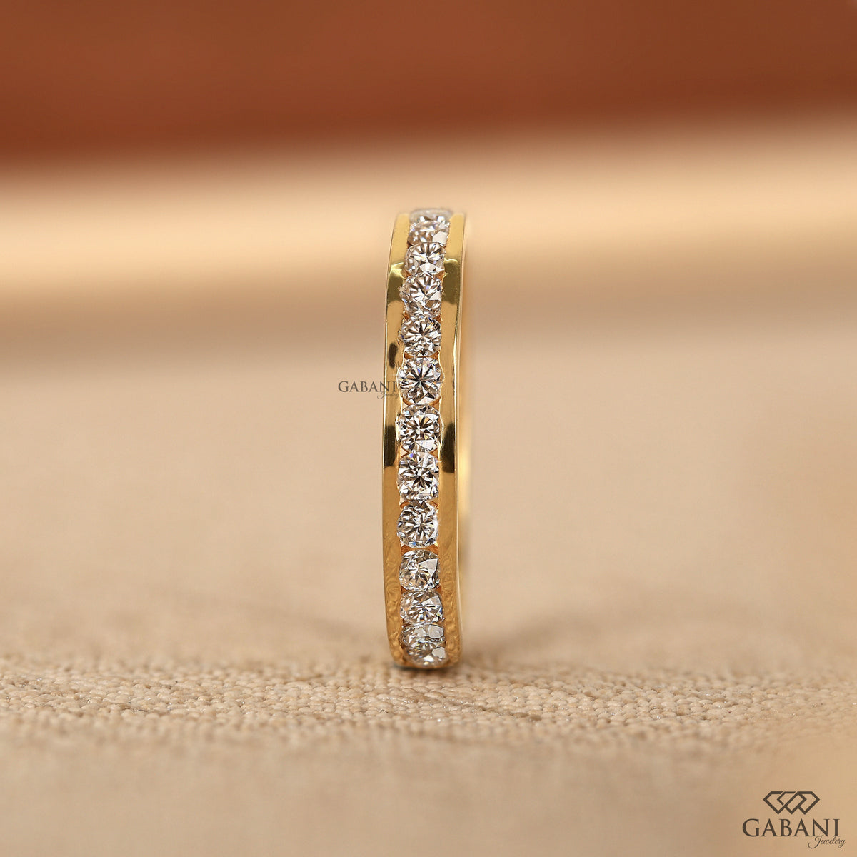 round lab grown diamond channel set ring in 14k yellow gold comfort fit