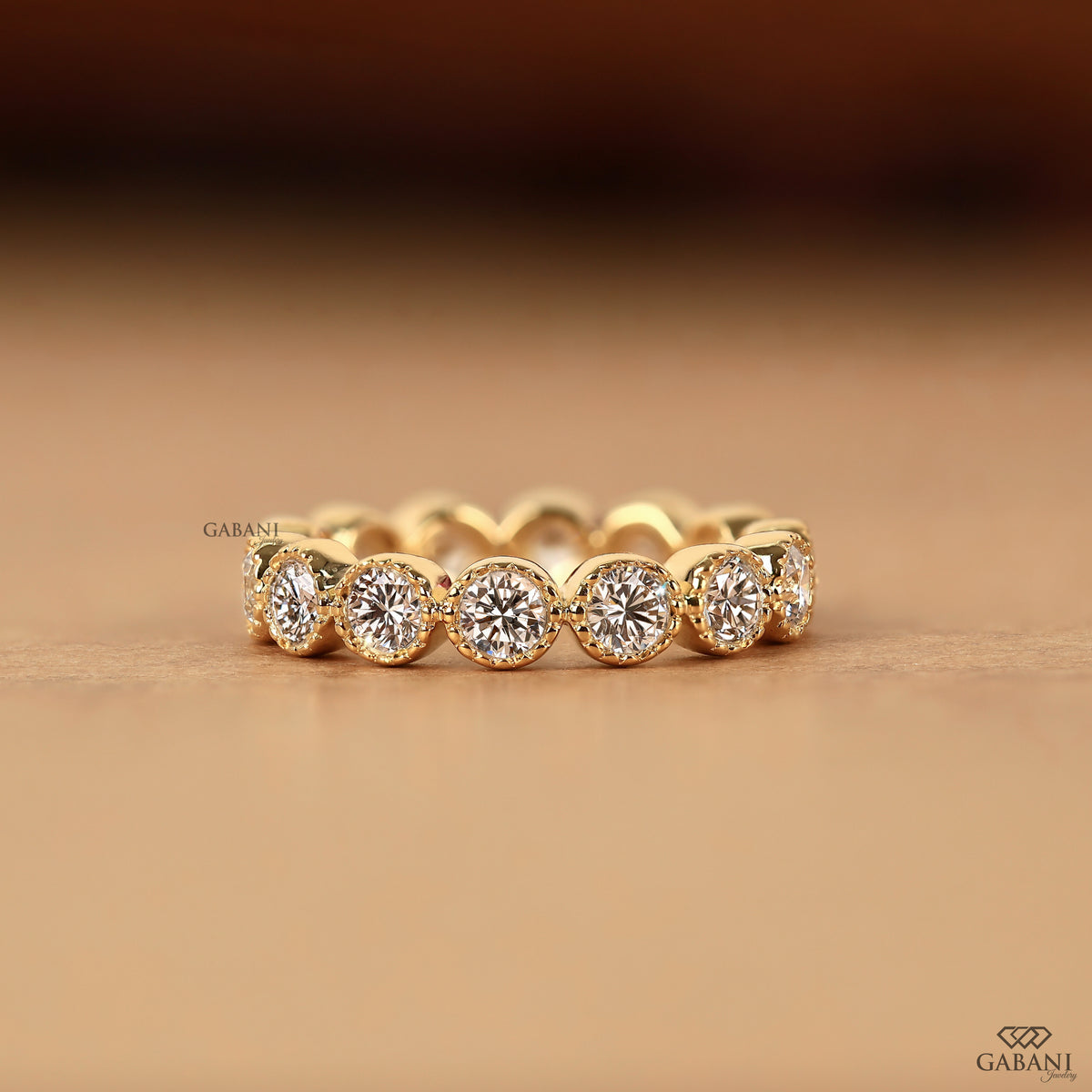 round lab diamond eternity band in 14k gold with milgrain detailing by gabani jewelry
