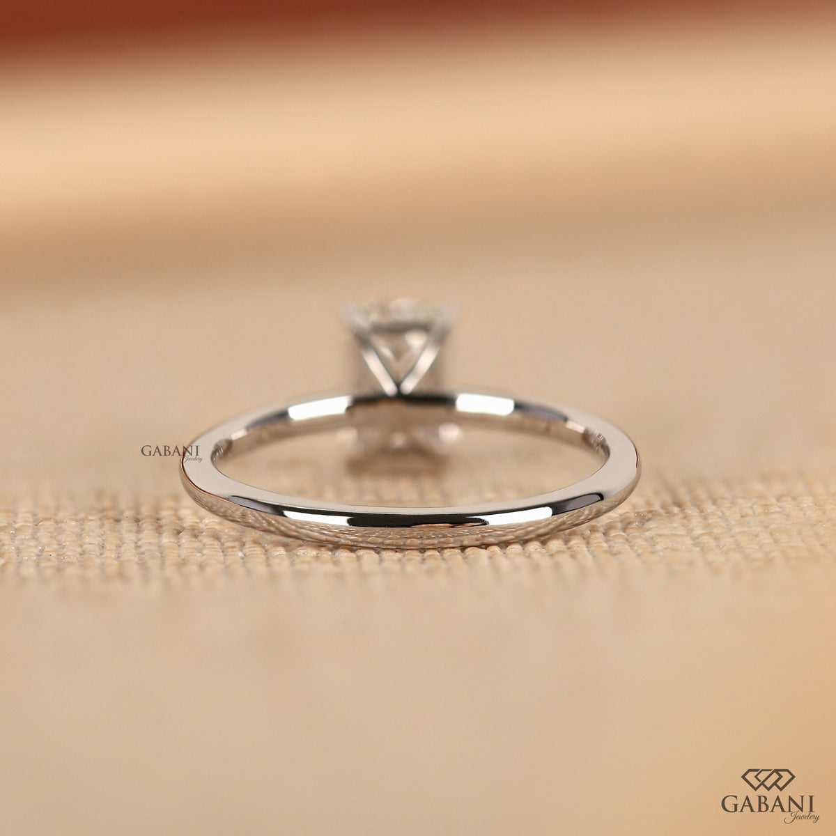 emerald cut lab grown diamond ring with refined prong set solitaire style