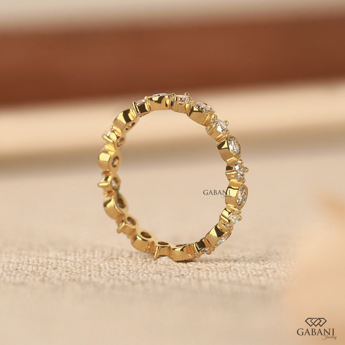 bezel and prong set round lab grown diamond band with seamless eternity design