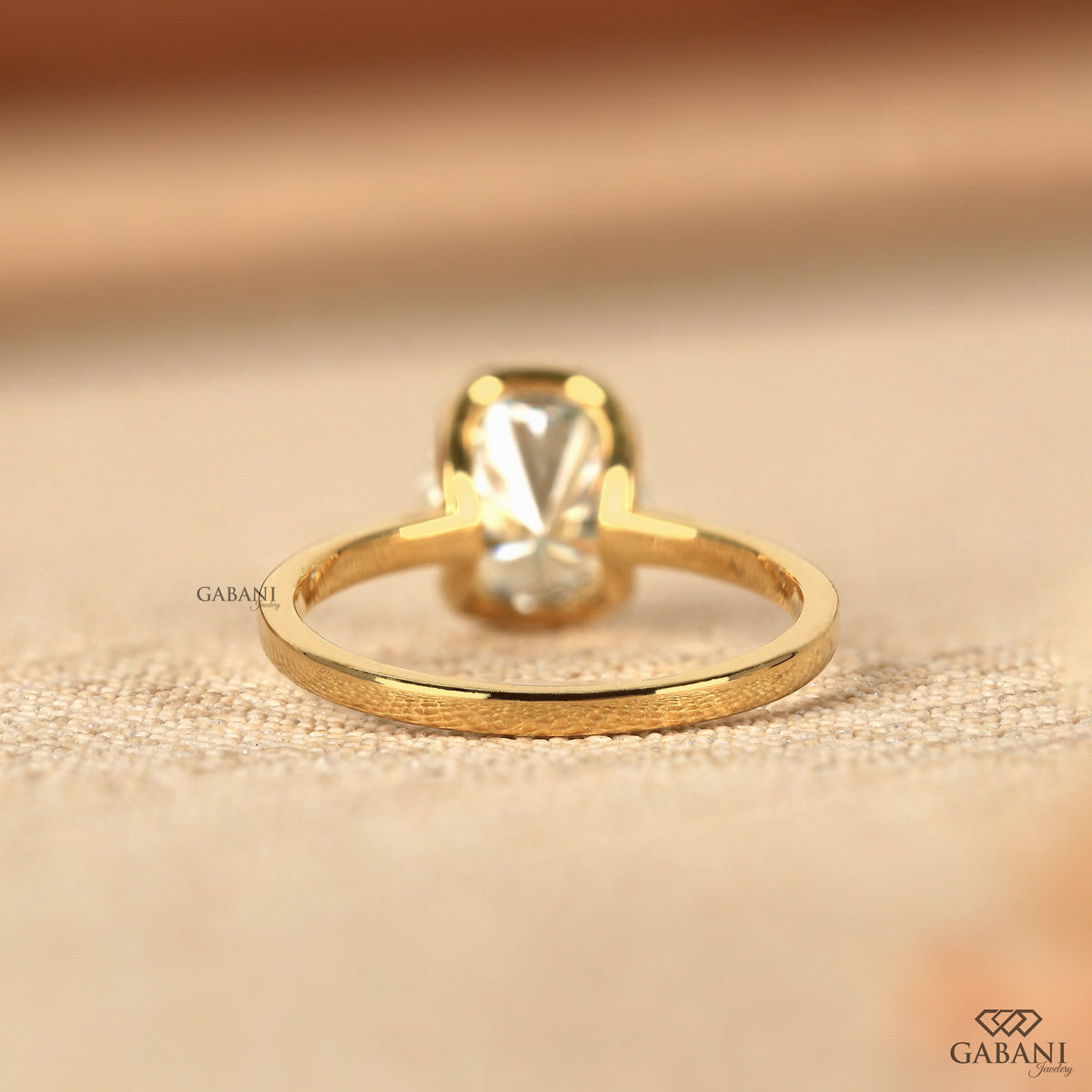modern solitaire ring with round lab grown diamond half bezel setting
