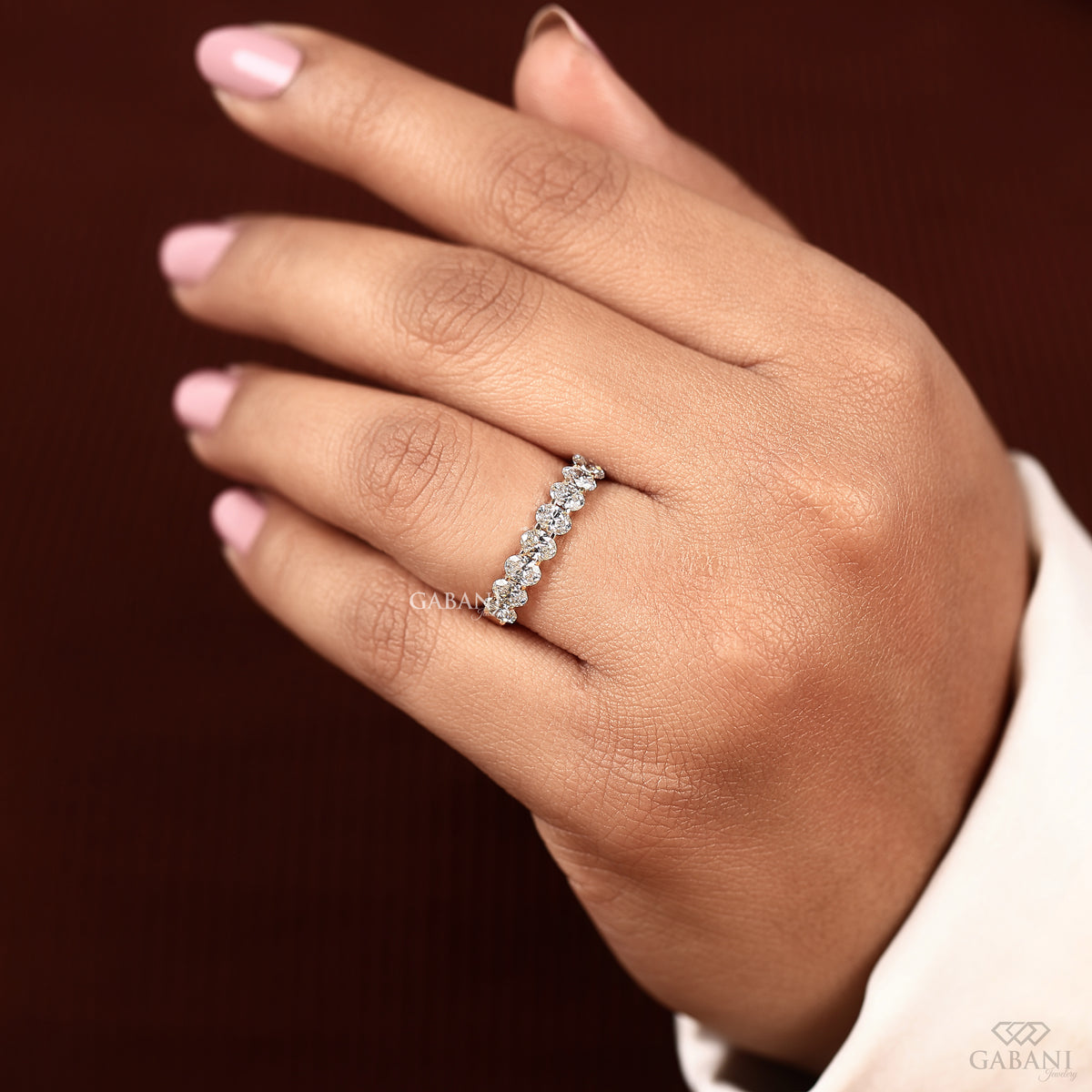 oval diamond band with lab stones in u prong setting
