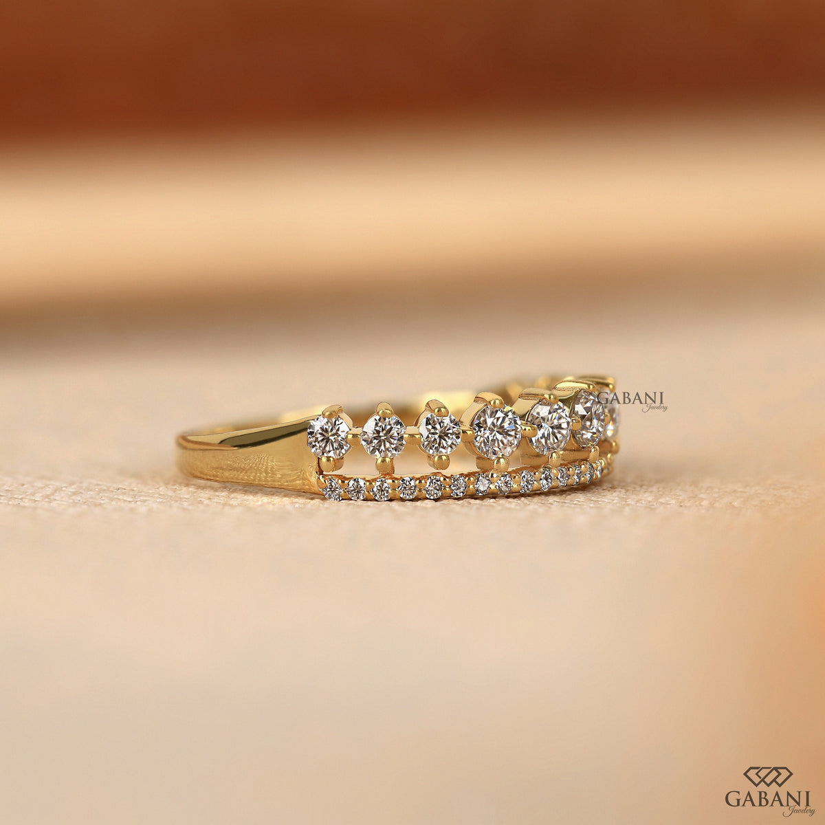 lab grown diamond wedding band with round stones and tiara inspired shape