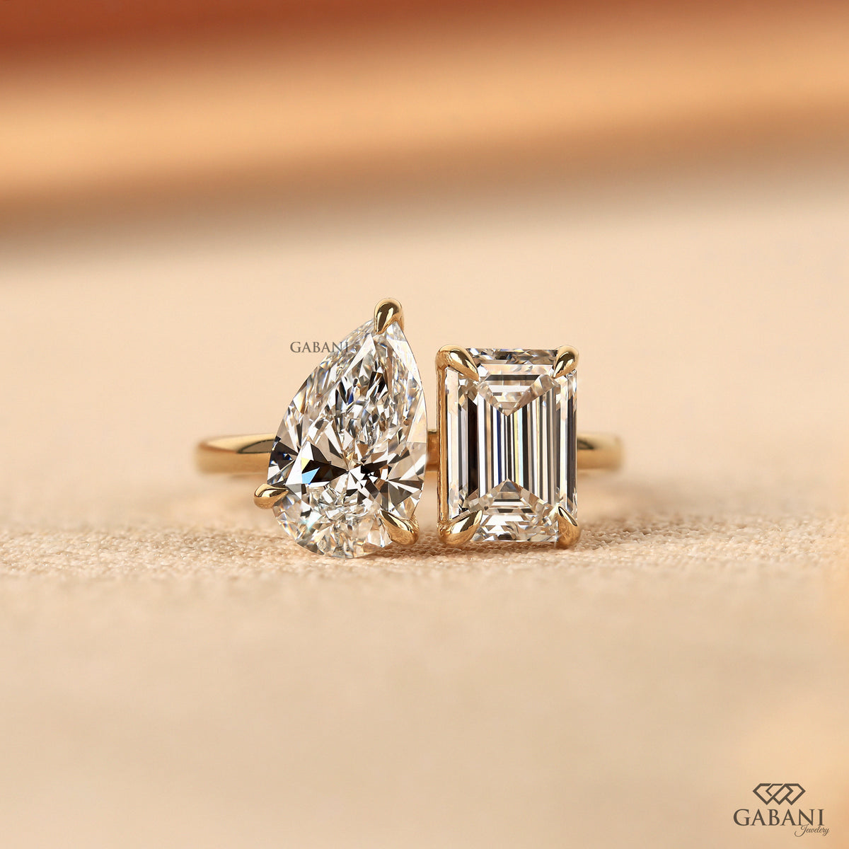 Emerald and pear cut lab grown diamond Toi et Moi ring in 14K solid yellow gold with two stone claw prong design