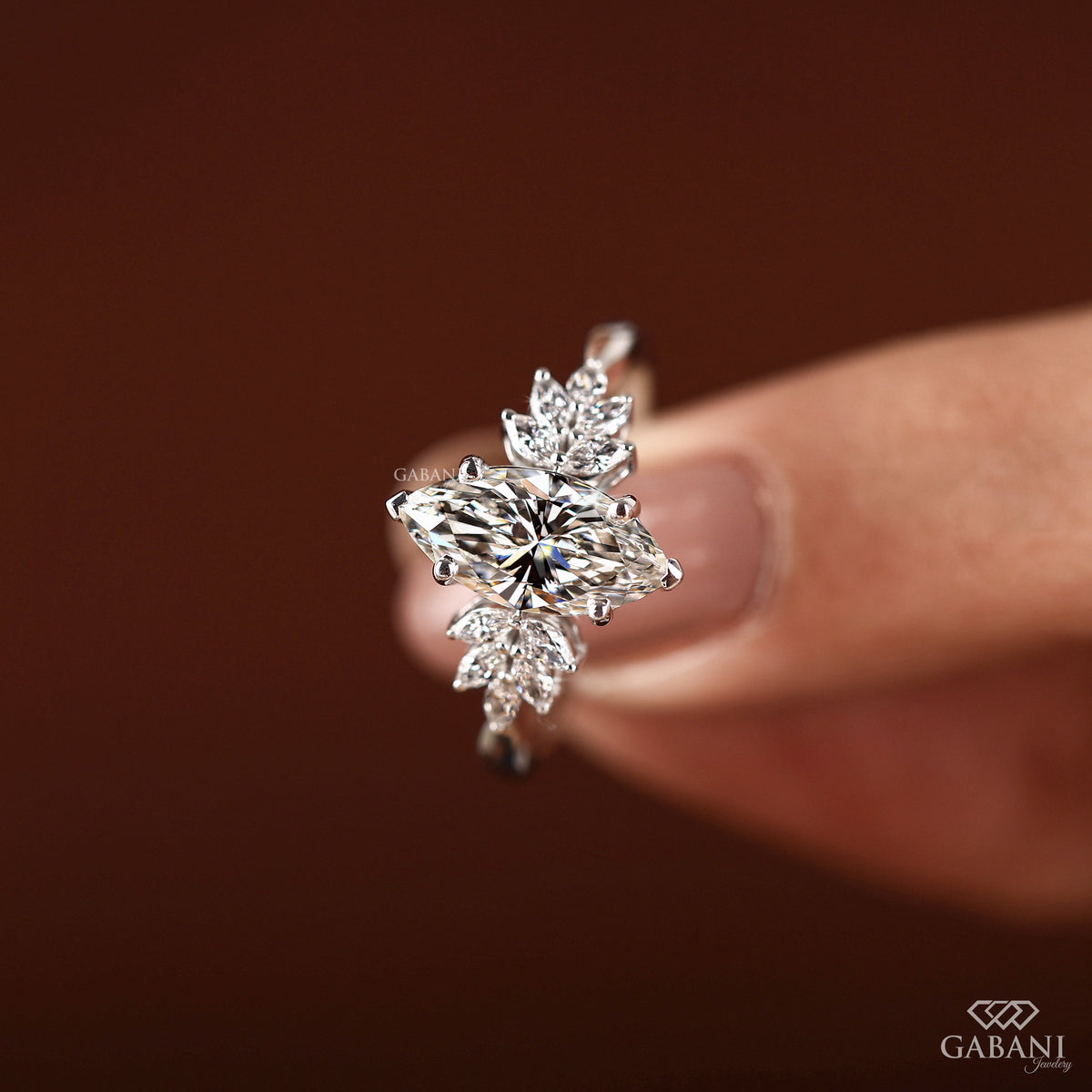 White gold engagement ring featuring marquise cut IGI certified lab grown diamond in secure prong setting